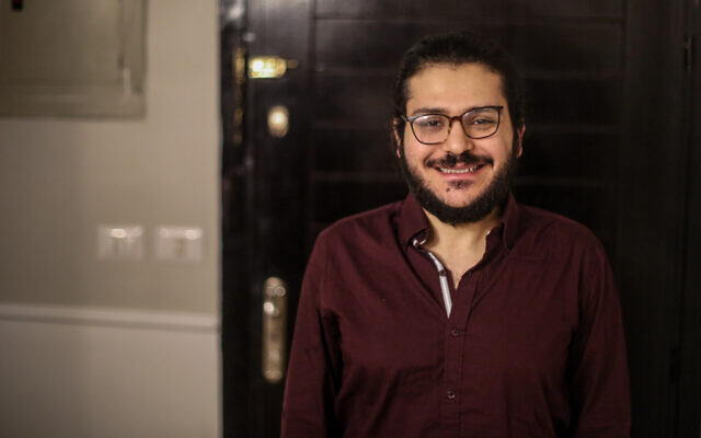 Egyptian researcher Patrick Zaki is pictured at his family home in Cairo, on December 9, 2021, following his release earlier in the week. (Mohamed El-Raai/AFP)