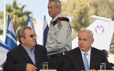 Prime Minister Benjamin Netanyahu, right, sits with former prime minister Ehud Barak, left, as former IDF chief of staff Lt. Gen. Benny Gantz walks during a press conference at the Tel Nof Air Force base, October 18, 2011. (AP Photo/Sebastian Scheiner)