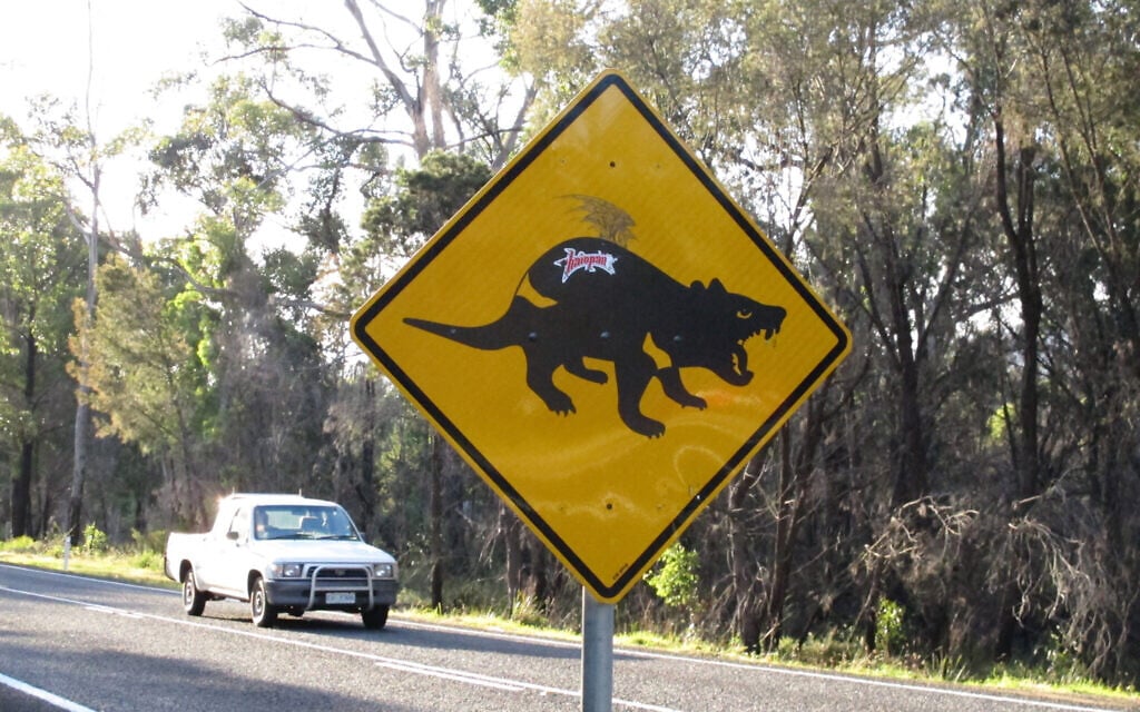 A partly defaced sign warns motorists to beware of Tasmanian devils on Tasman Peninsula, Tasmania state, Australia,  April 18, 2016. (AP Photo/Rod McGuirk)