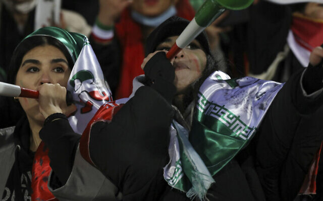 Iranian women fans blow horns after the final whistle during a soccer match of their national team with Iraq in 2022 World Cup qualifiers, at the Azadi stadium in Tehran, Iran, January 27, 2022. (Vahid Salemi/AP) Iranian women fans blow horns after the final whistle during a soccer match of their national team with Iraq in 2022 World Cup qualifiers, at the Azadi stadium in Tehran, Iran, January 27, 2022. (Vahid Salemi/AP)