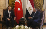 Egyptian Foreign Minister Sameh Shoukry, right, meets with his Turkish counterpart Mevlut Cavusoglu at Tahrir Palace in Cairo, Egypt, March 18, 2023. (Amr Nabil/AP)