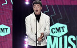 Noah Schnapp presents the award for collaborative video of the year at the CMT Music Awards at the Moody Center in Austin, Texas, on April 2, 2023. (Evan Agostini/Invision/AP)