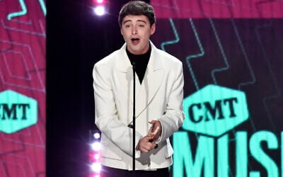 Noah Schnapp presents the award for collaborative video of the year at the CMT Music Awards at the Moody Center in Austin, Texas, on April 2, 2023. (Evan Agostini/Invision/AP)