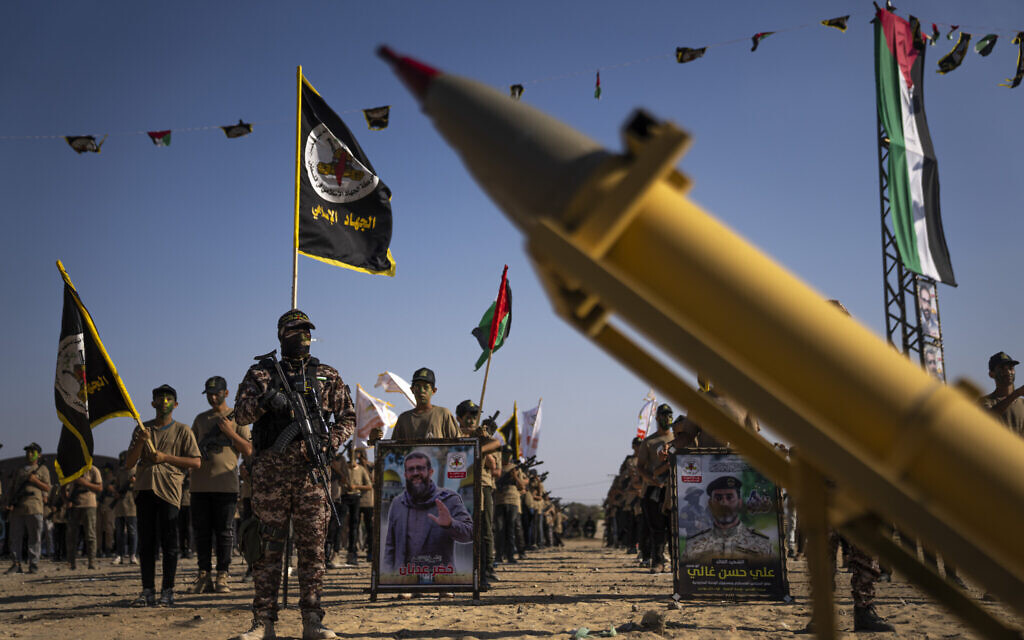 Rockets are seen next to children at an Islamic Jihad summer camp in Khan Younis, southern Gaza Strip, Thursday, June 22, 2023. (AP/Fatima Shbair)