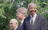 From left, F.W. de Klerk, President Bill Clinton, and Nelson Mandela appear at ceremonies honoring the two South African leaders with the Philadelphia Liberty Medal at Independence Hall in Philadelphia, July 4, 1993. (AP Photo/Greg Gibson, File)