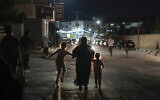 Residents of the Jenin refugee camp evacuate their homes as the Israeli military pressed ahead with an operation in the area, in the West Bank Monday, July 3, 2023. (AP/Majdi Mohammed)
