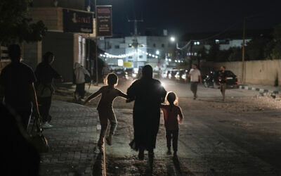 Residents of the Jenin refugee camp evacuate their homes as the Israeli military pressed ahead with an operation in the area, in the West Bank Monday, July 3, 2023. (AP/Majdi Mohammed)