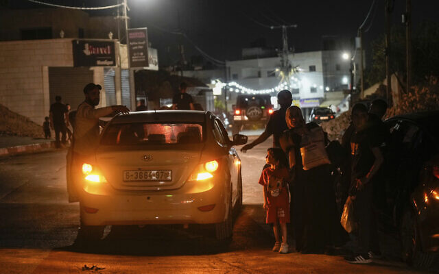 Residents of the Jenin refugee camp evacuate their homes as the Israeli military pressed ahead with a counter-terrorism operation in the area. At least eight Palestinians were killed and dozens wounded. (AP/Majdi Mohammed)