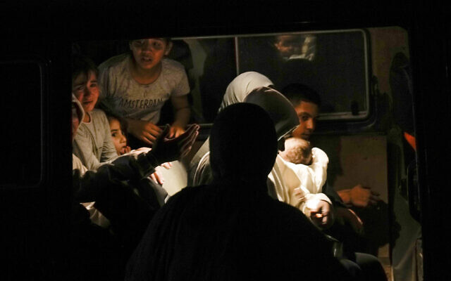 Residents of the Jenin refugee camp evacuate their homes as the Israeli military pressed ahead with a counter-terrorism operation in the area, July 3, 2023. At least eight Palestinians were killed and dozens wounded. (AP/Majdi Mohammed)