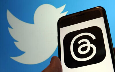 This photo, taken in New York on Wednesday, July 5, 2023, show the logo for Meta's new app Threads, right, and that of Twitter. (AP/Richard Drew)