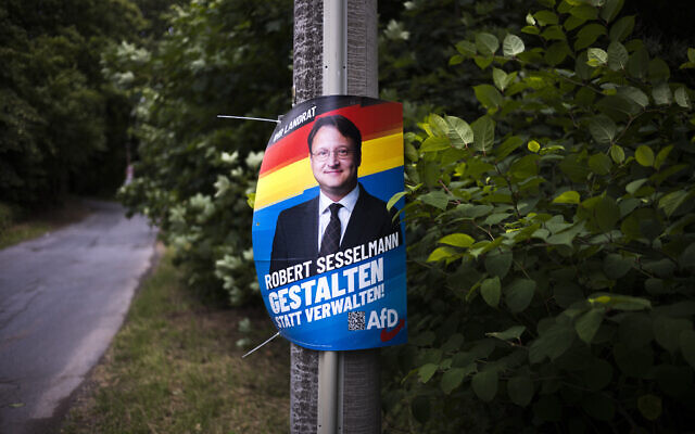A election campaign poster of far-right AfD candidate Robert Sesselmann remains at a street at the outskirts of the small city Sonneberg at the German federal state Thuringia, Wednesday, July 5, 2023. (AP Photo/Markus Schreiber) A election campaign poster of far-right AfD candidate Robert Sesselmann remains at a street at the outskirts of the small city Sonneberg at the German federal state Thuringia, Wednesday, July 5, 2023. (AP Photo/Markus Schreiber)