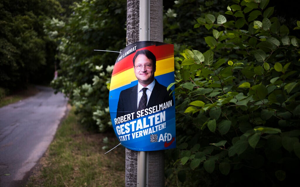 A election campaign poster of far-right AfD candidate Robert Sesselmann remains at a street at the outskirts of the small city Sonneberg at the German federal state Thuringia, July 5, 2023 (AP Photo/Markus Schreiber) A election campaign poster of far-right AfD candidate Robert Sesselmann remains at a street at the outskirts of the small city Sonneberg at the German federal state Thuringia, July 5, 2023 (AP Photo/Markus Schreiber)