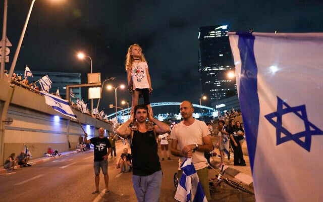 Israelis protest against plans by Prime Minister Benjamin Netanyahu's government to overhaul the judicial system, in Tel Aviv, July 8, 2023. (AP Photo/Tsafrir Abayov) Israelis protest against plans by Prime Minister Benjamin Netanyahu's government to overhaul the judicial system, in Tel Aviv, July 8, 2023. (AP Photo/Tsafrir Abayov)