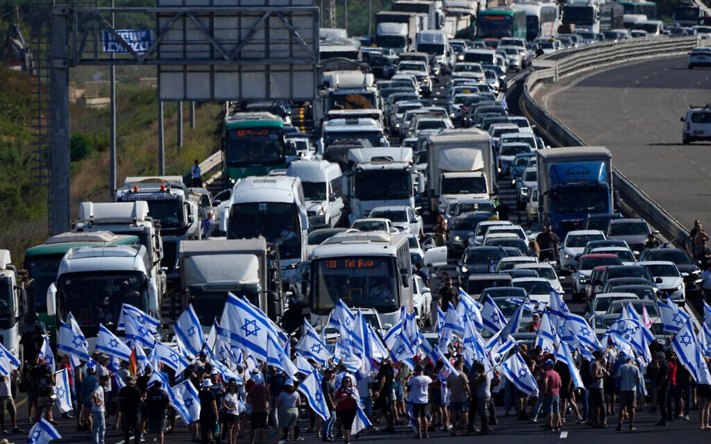 Protesters block the Tel Aviv-Haifa highway near Beit Yanai during a protest against the judicial overhaul, July 11, 2023 (AP Photo/Ariel Schalit)