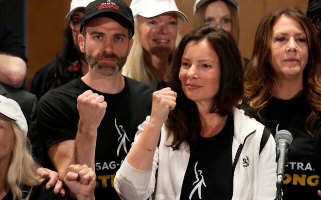SAG-AFTRA president Fran Drescher, center, Ben Whitehair, left, and Joely Fisher attend a press conference announcing a strike by The Screen Actors Guild-American Federation of Television and Radio Artists on Thursday, July, 13, 2023, in Los Angeles. (AP Photo/Chris Pizzello) SAG-AFTRA president Fran Drescher, center, Ben Whitehair, left, and Joely Fisher attend a press conference announcing a strike by The Screen Actors Guild-American Federation of Television and Radio Artists on Thursday, July, 13, 2023, in Los Angeles. (AP Photo/Chris Pizzello)