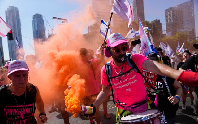 Protesters against plans by Prime Minister Benjamin Netanyahu's government to overhaul the judicial system in Tel Aviv, July 18, 2023. (AP Photo/Ohad Zwigenberg)