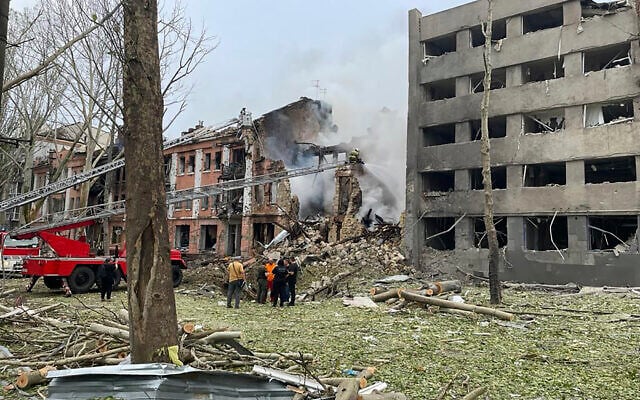 In this photo provided by the National Police of Ukraine, members of emergency services work at a building destroyed by a Russian attack in Mykolaiv, Ukraine, July 20, 2023. (National Police of Ukraine via AP) In this photo provided by the National Police of Ukraine, members of emergency services work at a building destroyed by a Russian attack in Mykolaiv, Ukraine, July 20, 2023. (National Police of Ukraine via AP)