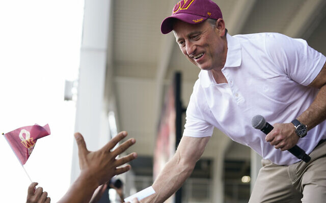 Josh Harris, the leader of a US group buying the Washington Commanders, greets fans during an NFL football pep rally at FedEx Field in Landover, Maryland, July 21, 2023. (AP Photo/Stephanie Scarbrough) Josh Harris, the leader of a US group buying the Washington Commanders, greets fans during an NFL football pep rally at FedEx Field in Landover, Maryland, July 21, 2023. (AP Photo/Stephanie Scarbrough)