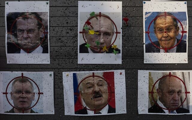 Illustrative - Darts are stuck on a paper target made with an image of Russian President Vladimir Putin at a popular beachside attraction in Odesa, Ukraine, July 23, 2023. (Jae C. Hong/AP)