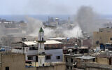 Smoke rises during a clashes that erupted between members of the Palestinian Fatah group and Islamist militants in the Palestinian refugee camp of Ein el-Hilweh near the southern port city of Sidon, Lebanon, July 30, 2023. (Mohammad Zaatari/AP)