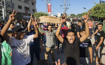 Palestinian demonstrators chant slogans against Hamas in the Gaza Strip during a protest against the territory's chronic power outages and difficult living conditions along the streets of Khan Younis, Sunday, July 30, 2023.  (AP Photo)