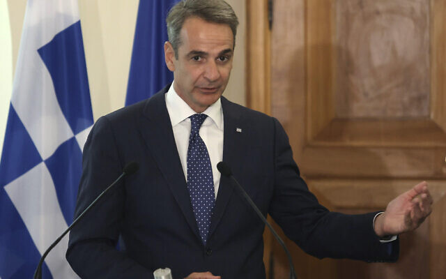 Greek Prime Minister Kyriakos Mitsotakis addresses the media, during a press conference with Cyprus' President Nikos Christodoulide in Nicosia, Cyprus, July 31, 2023. (Yiannis Kourtoglou Pool via AP)