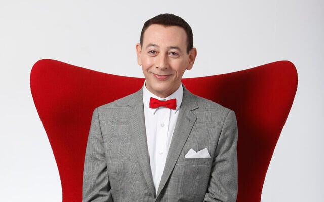 Actor Paul Reubens, portraying Pee-wee Herman, poses for a portrait while promoting 'The Pee-wee Herman Show' live stage play, December 7, 2009, in Los Angeles, California. (AP Photo/Danny Moloshok, File)