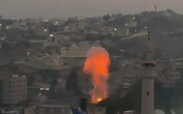 An explosion from an improvised bomb is seen in the Nur Shams refugee camp near Tulkarem in the West Bank, amid an IDF raid, July 24, 2023. (Screenshot: Twitter)