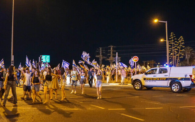 Protesters rallying in Beersheba on July 11, 2023. (Emanuel Fabian/Times of Israel)