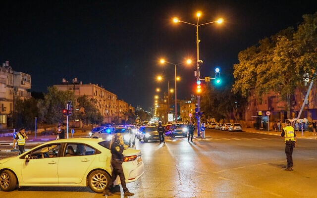 Police block roads during an anti-judicial overhaul protest in Beersheba on July 11, 2023. (Emanuel Fabian/Times of Israel) Police block roads during an anti-judicial overhaul protest in Beersheba on July 11, 2023. (Emanuel Fabian/Times of Israel)