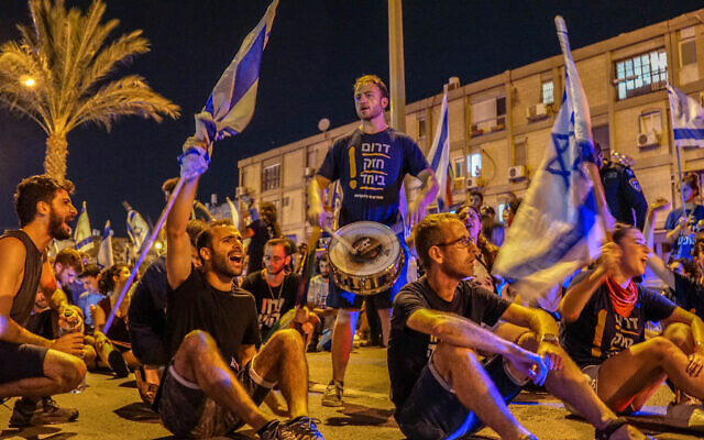 Protesters block a road in Beersheba on July 11, 2023. (Emanuel Fabian/Times of Israel) Protesters block a road in Beersheba on July 11, 2023. (Emanuel Fabian/Times of Israel)