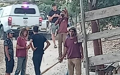 Israeli settlers are seen approaching Palestinians in the Arab al-Khouli hamlet, near the West Bank outpost of El Matan,  July 13, 2023. (Courtesy via Yesh Din)