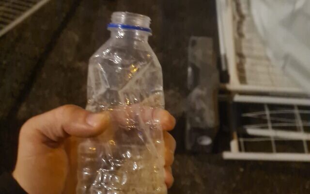 A water bottle filled with some sand that was thrown at police during a protest against the judicial overhaul in Tel Aviv on July 24, 2023. (Israel Police) A water bottle filled with some sand that was thrown at police during a protest against the judicial overhaul in Tel Aviv on July 24, 2023. (Israel Police)