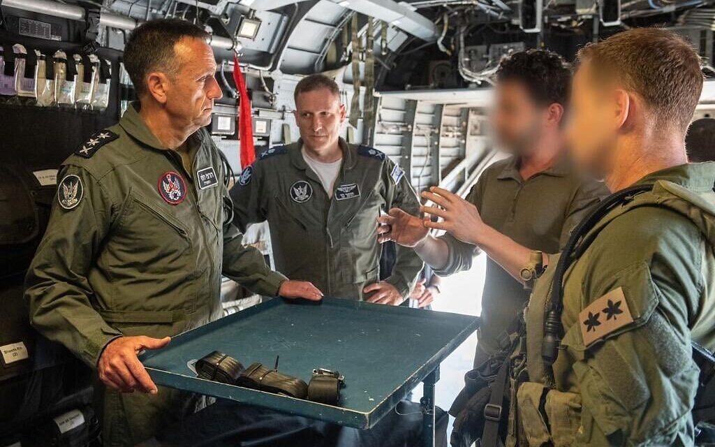 IDF Chief of Staff Lt. Gen. Herzi Halevi (left) and IAF chief Maj. Gen. Tomer Bar (center) speak with two officers at the Tel Nof airbase, July 19, 2023. (Israel Defense Forces) IDF Chief of Staff Lt. Gen. Herzi Halevi (left) and IAF chief Maj. Gen. Tomer Bar (center) speak with two officers at the Tel Nof airbase, July 19, 2023. (Israel Defense Forces)
