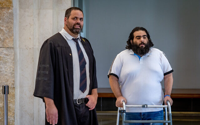 File: Mor Ganashvili, who was seriously injured during a lynching in Acre last year, arrives for a court hearing of one of his attackers at the Supreme Court in Jerusalem, May 17, 2023. (Yonatan Sindel/Flash90) File: Mor Ganashvili, who was seriously injured during a lynching in Acre last year, arrives for a court hearing of one of his attackers at the Supreme Court in Jerusalem, May 17, 2023. (Yonatan Sindel/Flash90)