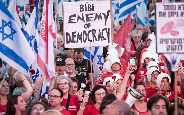 People attend a protest against the planned judicial overhaul in Tel Aviv, on July 1, 2023. (Miriam Alster/Flash90)
