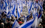 People attend a protest against the planned judicial overhaul in Tel Aviv, on July 1, 2023. (Miriam Alster/Flash90)