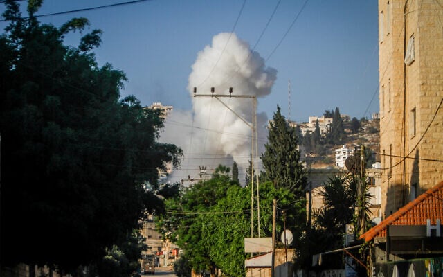 Smoke rises as Israel begins an operation in the West Bank city of Jenin, July 3, 2023 (Nasser Ishtayeh/Flash90) Smoke rises as Israel begins an operation in the West Bank city of Jenin, July 3, 2023 (Nasser Ishtayeh/Flash90)