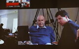 Businessman Arnon Milchan seen on a screen before his testimony in Netanyahu's Case 1000 corruption trial, in Brighton, on July 3, 2023. (Alex Kolomoisky/POOL/Flash90)