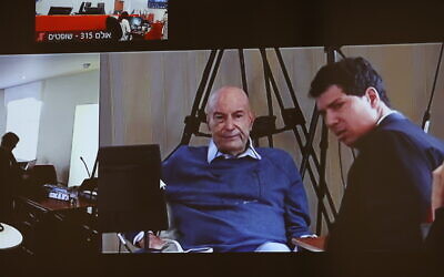 Businessman Arnon Milchan seen on a screen before his testimony in Netanyahu's Case 1000 corruption trial, in Brighton, on July 3, 2023. (Alex Kolomoisky/POOL/Flash90) Businessman Arnon Milchan seen on a screen before his testimony in Netanyahu's Case 1000 corruption trial, in Brighton, on July 3, 2023. (Alex Kolomoisky/POOL/Flash90)