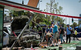 Police and rescue forces at the scene of a car ramming terror attack in north Tel Aviv on June 4, 2023. (Avshalom Sassoni/Flash90)