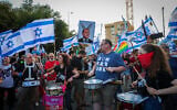Israelis protest against the judicial overhaul, outside Economy Minister Nir Barkat's home in Jerusalem, July 6, 2023. (Noam Revkin Fenton/Flash90)
