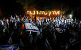 Reservists protest against the government's judicial overhaul, outside the home of Defense Minister Yoav Gallant in Moshav Amikam, on July 8, 2023 (Shir Torem/Flash90)