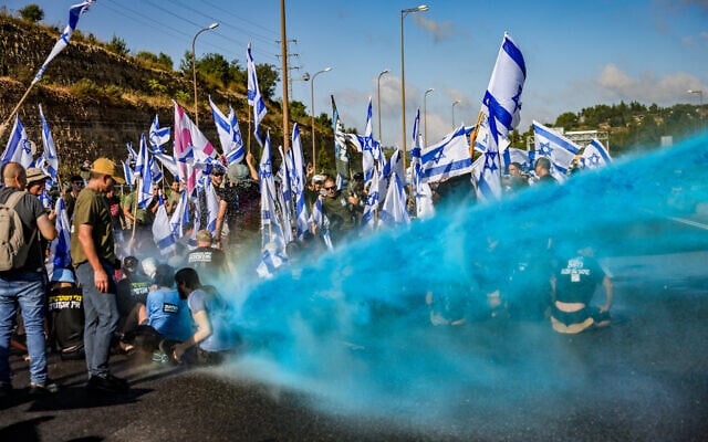 Police deploy water cannons against demonstrators against the judicial overhaul on Road number 1, near Ein Hemed, July 11, 2023 (Chaim Goldberg/Flash90) Police deploy water cannons against demonstrators against the judicial overhaul on Road number 1, near Ein Hemed, July 11, 2023 (Chaim Goldberg/Flash90)