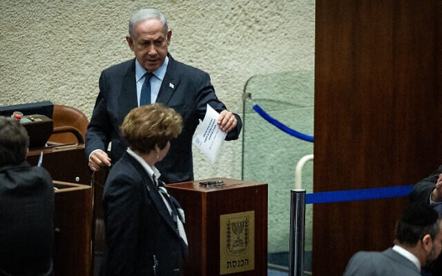 Prime Minister Benjamin Netanyahu casts his vote for representatives for the Judicial Selection Committee, in the Knesset, July 12, 2023. (Yonatan Sindel/Flash90) Prime Minister Benjamin Netanyahu casts his vote for representatives for the Judicial Selection Committee, in the Knesset, July 12, 2023. (Yonatan Sindel/Flash90)