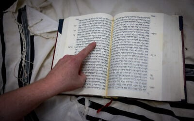 Illustrative image: A Hebrew Bible at a synagogue in Jerusalem, July 14, 2023. (Chaim Goldberg/Flash90)