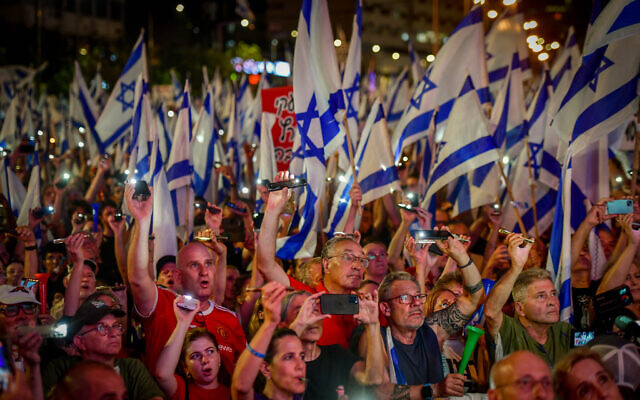 People attend a protest against the government's judicial overhaul plans in Tel Aviv, on July 15, 2023. (Avshalom Sassoni/Flash90) People attend a protest against the government's judicial overhaul plans in Tel Aviv, on July 15, 2023. (Avshalom Sassoni/Flash90)