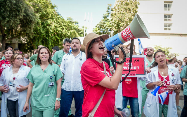 Medical staff protest against the judicial overhaul in Tel Aviv, during a two-hour strike in hospitals around Israel, July 19, 2023. (Avshalom Sassoni/Flash90) Medical staff protest against the judicial overhaul in Tel Aviv, during a two-hour strike in hospitals around Israel, July 19, 2023. (Avshalom Sassoni/Flash90)