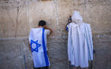 Anti-overhaul activists attend a special prayer at the Western Wall in Jerusalem's Old City, on July 23, 2023. (Chaim Goldberg/Flash90)