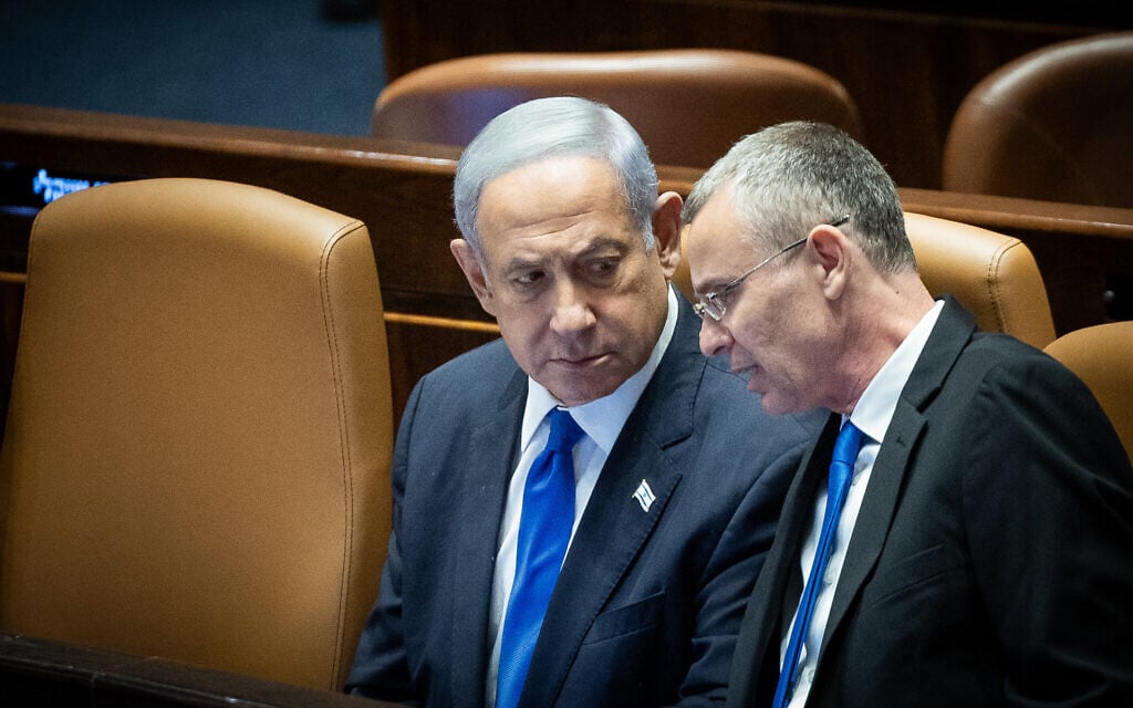 Prime Minister Benjamin Netanyahu, left, and Justice Minister Yariv Levin in the Knesset plenum during a vote on the coalition's 'reasonableness' bill, July 24, 2023. (Yonatan Sindel/Flash90) Prime Minister Benjamin Netanyahu, left, and Justice Minister Yariv Levin in the Knesset plenum during a vote on the coalition's 'reasonableness' bill, July 24, 2023. (Yonatan Sindel/Flash90)